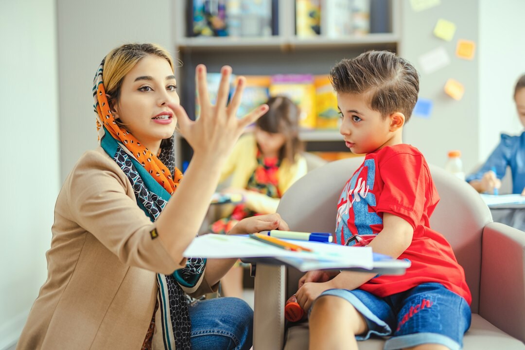 teacher helping students in classroom