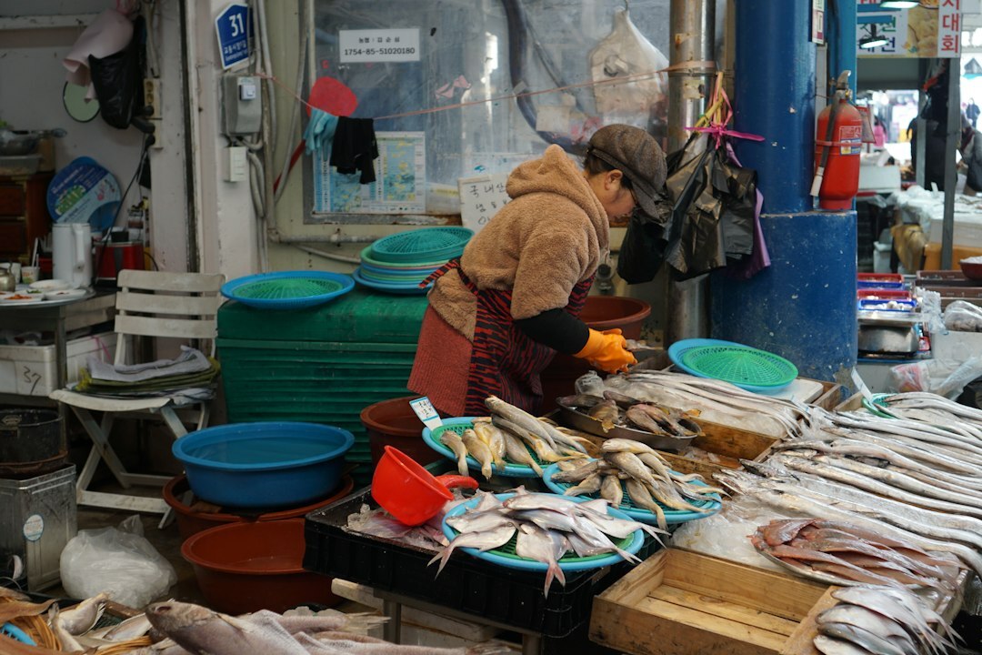 woman selling fish at market